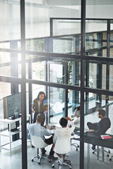 She doesnt mind elaborating. High angle shot of a businesswoman giving a presentation in the...