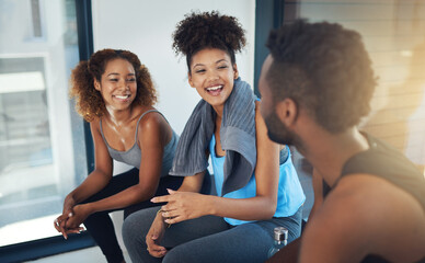 Let the energy of the group be your fuel. Cropped shot of three young people sitting in the gym after yoga class.