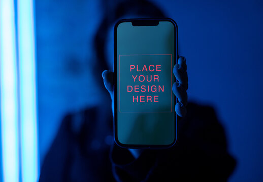 Unrecognizable Person Hold Smartphone in Neon Light