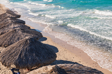 Palapas on a beach near La Paz, Mexico..