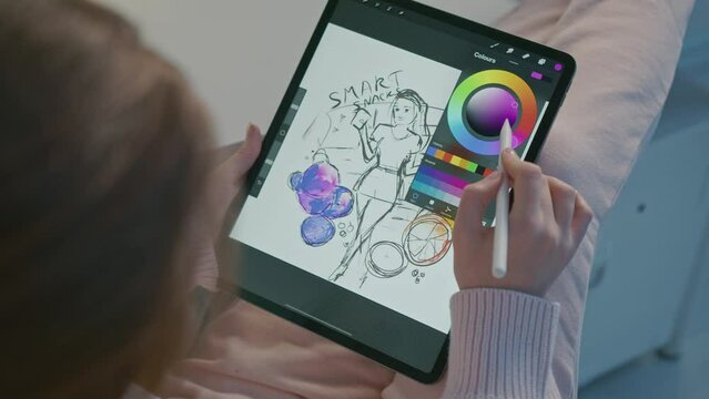 Female Designer Draws A Sketch On A Tablet Pc