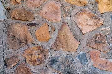 Detail of a wall made from rough cut stones.