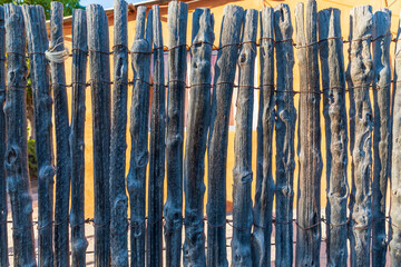 A stick fence in front of a house on the Baja peninsula.