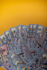 Finance and banks. American dollars on a yellow background.