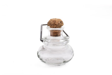 glass vial with a cork stopper on white background
