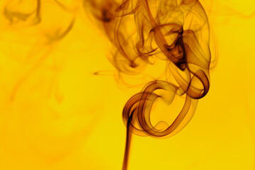 Abstract beautiful smoke against black background.  Swirling movement of smoke. Toxic movement of...