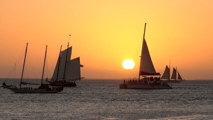 Sailing boats at the coast of Key West on sunset