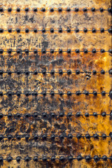 Ancient run-down copper door texture background