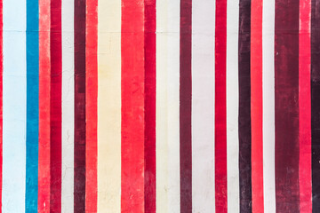 Grunge concrete wall with colorful stripes