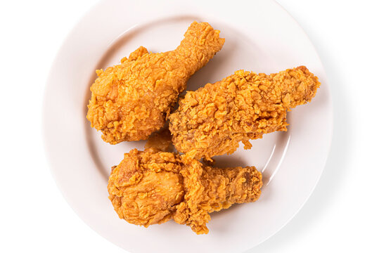 Top view . Fried chicken on white plate on white background.