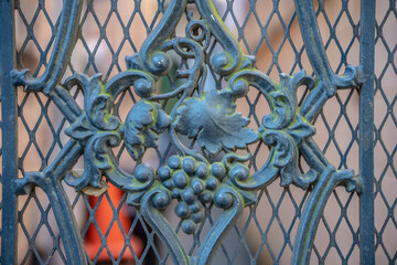 Detail on an antique iron fence in the French Quarter in New Orleans.