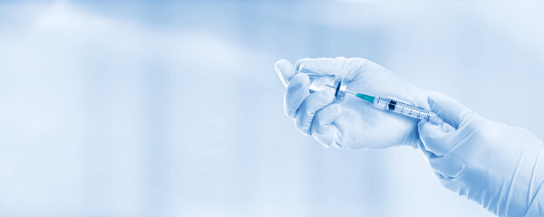 Hand holding viol with vaccine against corona virus. - obrazy, fototapety, plakaty