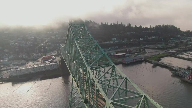 4K Aerial Big steel bridge with town on background Drone dolly in + left pan shot