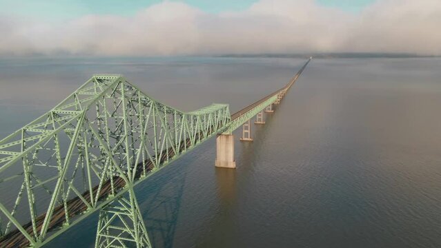 4K Aerial Big steel bridge on Columbia river in Oregon Drone dolly out + left pan shot
