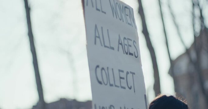 Protester carry sign equal rights wages women&rsquo;s day protest close up