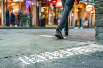 Tile Street sign for the famous Bourbon Street in the French Quarter. For effect, shallow focus is...