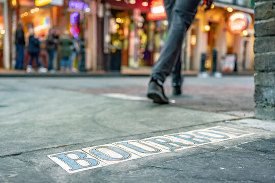 Tile Street sign for the famous Bourbon Street in the French Quarter. For effect, shallow focus is on the right side of the "O" in the sign.