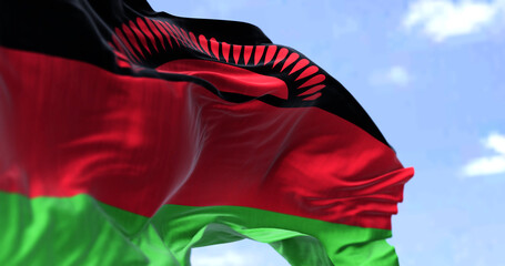 Detail of the national flag of Malawi waving in the wind on a clear day