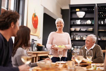 Friends and family are the true gifts in life. Shot of a family sitting down to dinner.