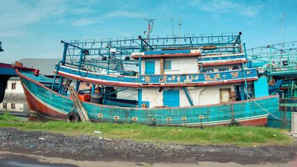 Fototapeta na wymiar Ships are docked at the port city of Tegal, Central Java, on the morning of March 2, 2022.