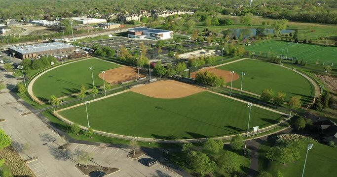 Aerial view of a multi-use playfield complex with soccer/lacrosse fields and softball fields with lights.