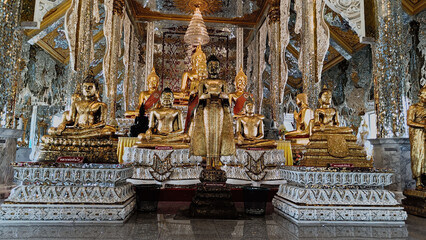 Several golden Buddha images lined up