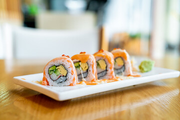 salmon roll sushi with sauce on top