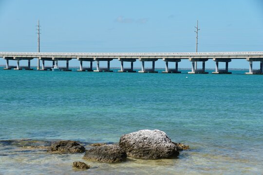 The rock formation overlooking the beautiful blue ocean and U.S Route 1 bridge at Bahia Honda State Park, Big Pine Key, Florida