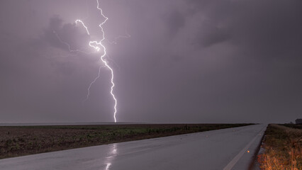 Nightscape lightning over road 