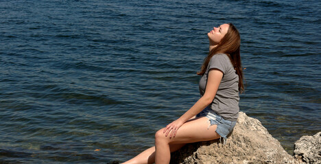Pretty woman enjoys the beautiful calm beaches with crystal clear water at the Florida Keys