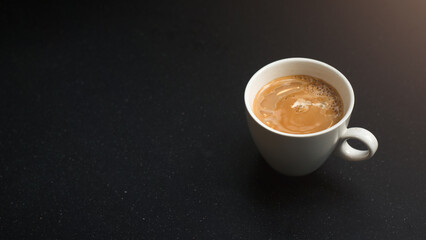 cup of coffee on black table in cafe