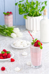Raspberry milkshake non alcoholic cocktail. Raspberry smoothie weight loss concept. Berry smoothie in a glass on the breakfast