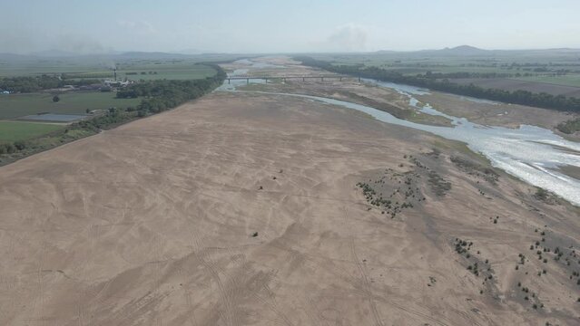 Panoramic View Of Burdekin With Low Tide River Near Inkerman Mill Estate At Home Hill In QLD Australia. Aerial Wide Shot