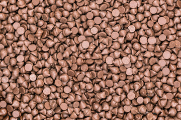 Top view pile of chocolate chips as a background.
