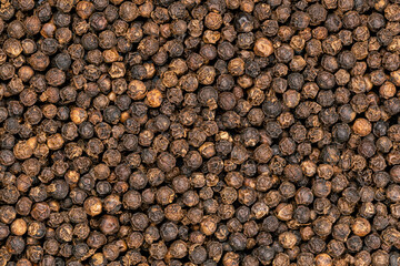 Top view pile of black pepper, full frame, use as a background.