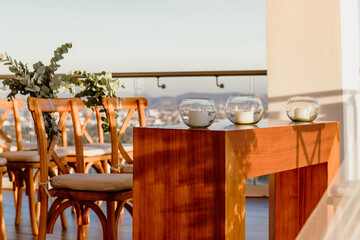 Wedding table set up with three bowls and candles sunny day golden hour