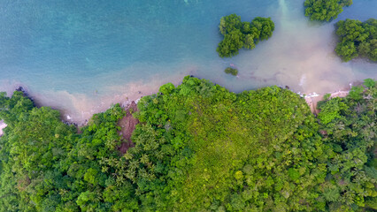 Beaches and mangrove forests located in Sitaro . Regency