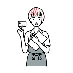 立って書類とカードを手に持つ店員の女性