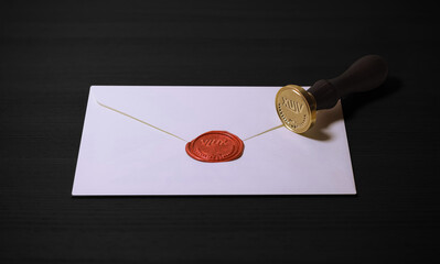 Letter seal with wax seal stamp. The vintage notary stamp and sealed envelope. Post concept. Dark...