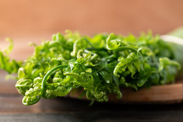 Asian Edible fern or fiddlehead fern from local farmer market, Healthy Leaf vegetable in spring season © nungning20