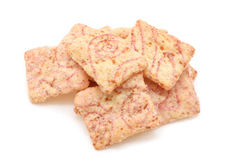 Muesli cereals extruded in flat shape with strawberry taste isolated on white