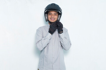 portrait handsome asian man with a motorcycle waring helmet on white background
