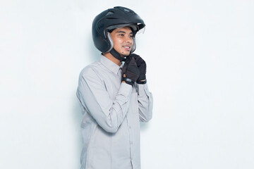 portrait handsome asian man with a motorcycle waring helmet on white background
