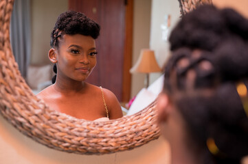 Portrait of woman staring at herself in mirror