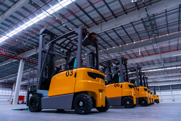 Group of forklifts truck in large warehouse