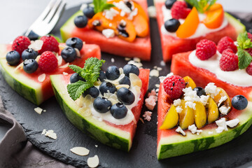 Watermelon pizza with berries, fruit, yogurt, feta cheese
