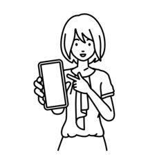 立ってスマートフォンを指差してこちらに向けて見せているオフィスカジュアルの女性