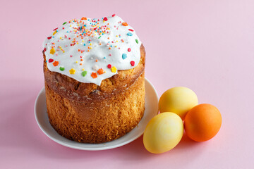 Easter cake and eggs on kitchen table.