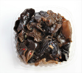 Tree mushrooms in Korean. Salad in a plastic disposable package.
