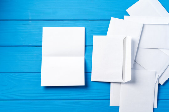 Stack Of Envelopes On Working Desk Top View. Business Mail